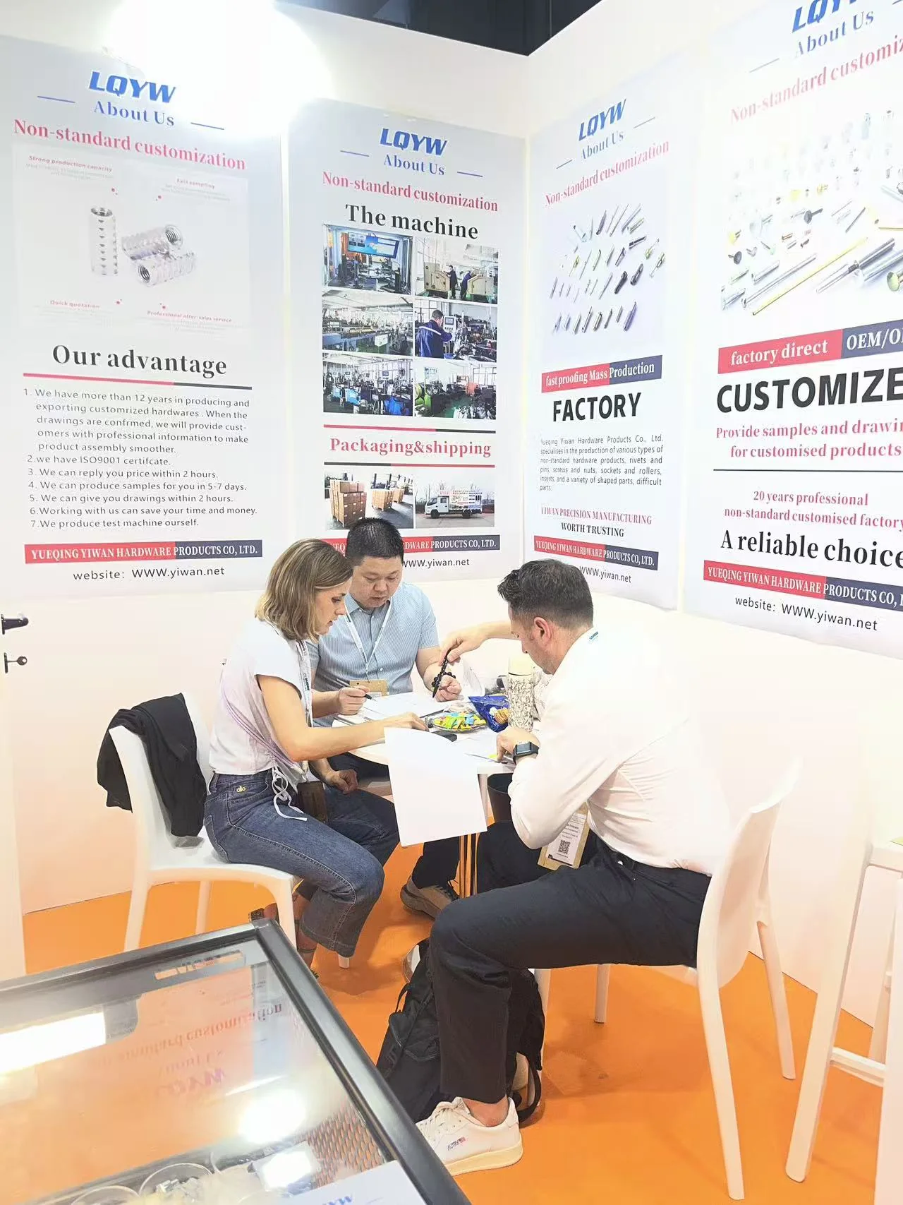 Visitors in discussion at the YIWAN booth during Fastener Fair Milan