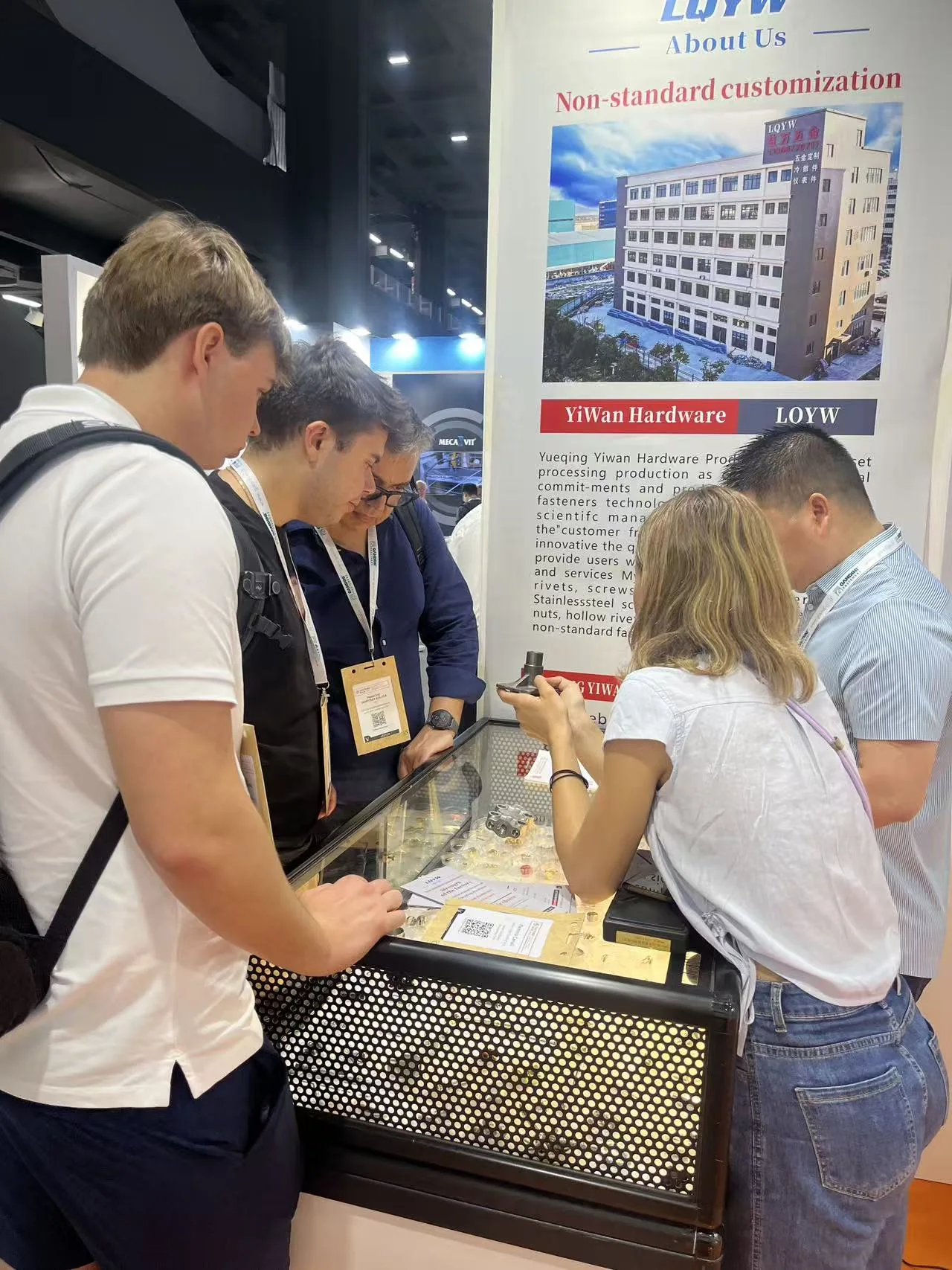 Buyers examining YIWAN fastener samples at Fastener Fair Milan 2026